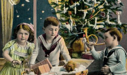 children around christmas tree