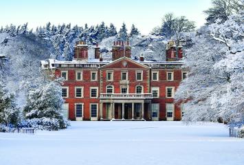 English country house in snow